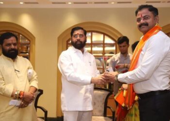 MLA Kishore Appa Patil congratulating Deputy Chief Minister Eknath Shinde. With him is MLA Bharat Gogawale. (File photo)