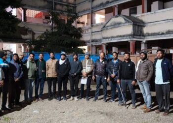 The seized tractor and the revenue department team