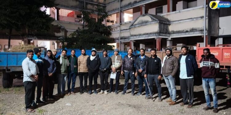 The seized tractor and the revenue department team